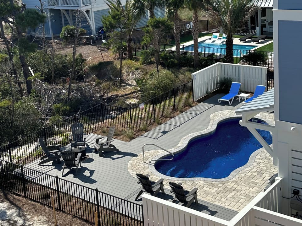Backyard oasis with pool, fire pit, undercover custom bar and lounge area