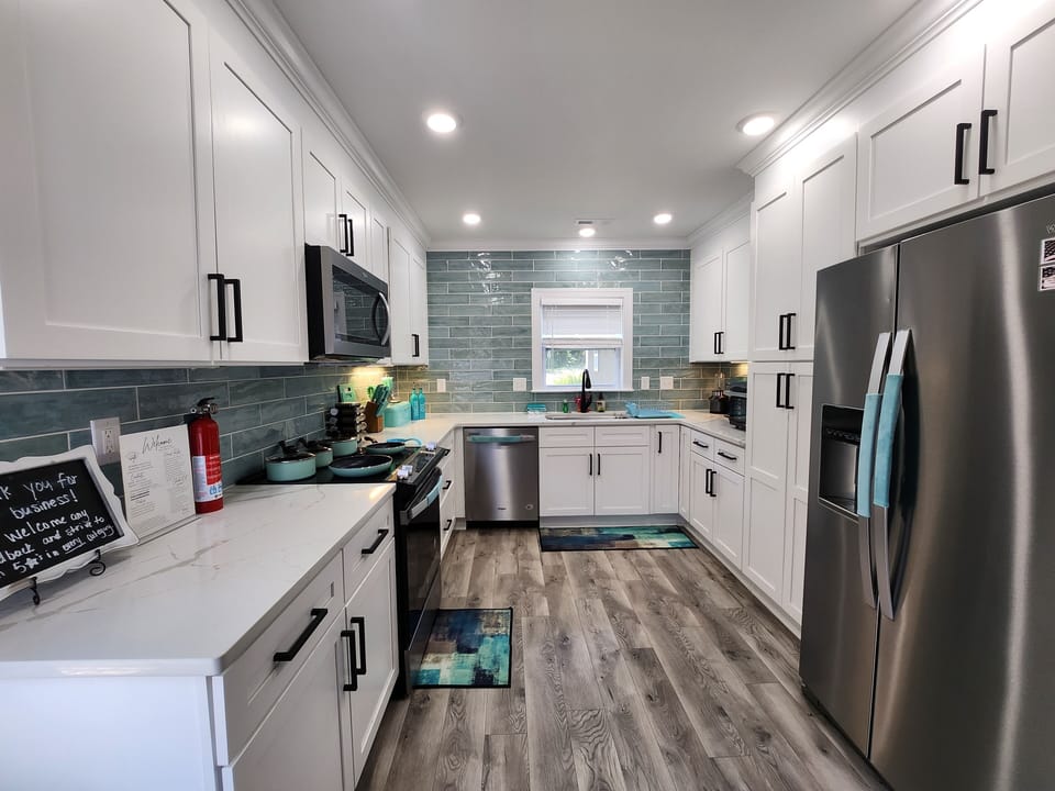 Fully equipped kitchen with all the essentials for cooking and meal prep during your stay.