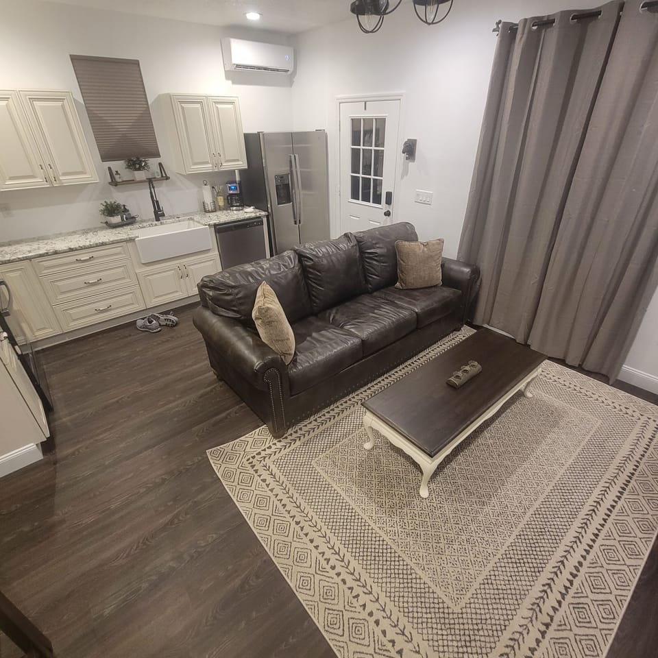 Living room and eating area next to full kitchen. 