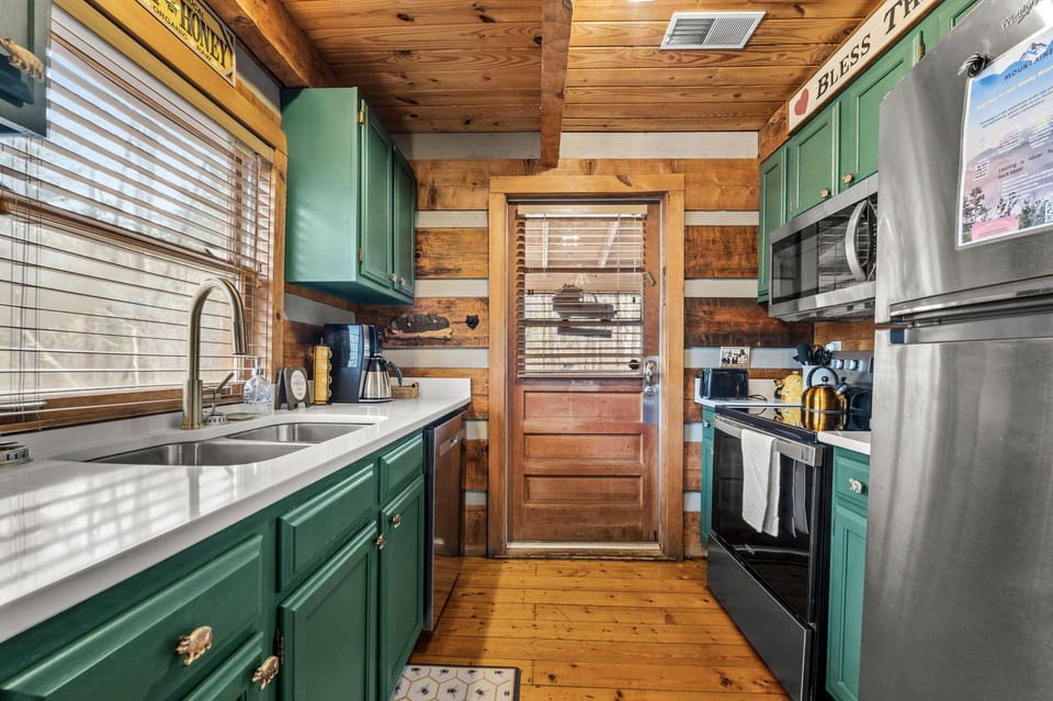 Brand new appliances and quartz countertops in the galley-style kitchen
