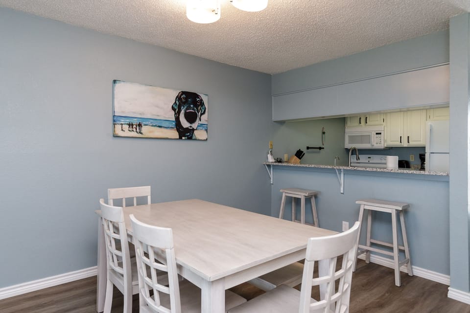 Your bright dining space flows seamlessly into the fully equipped kitchen, perfect for family meals and morning coffee.