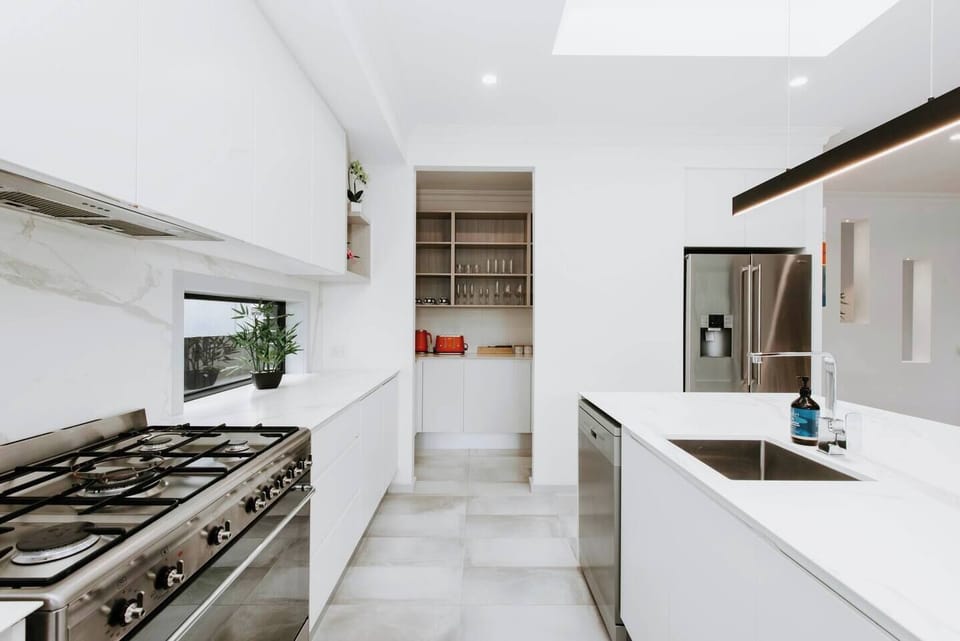 Cook up a feast in the kitchen, equipped with top-end appliances and a butler’s pantry.
