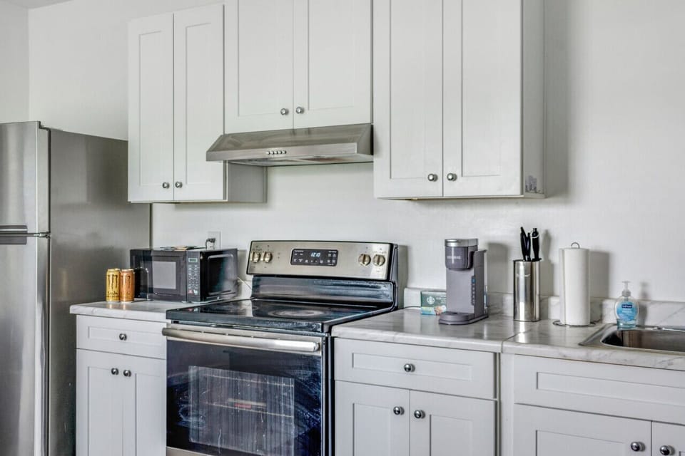 With toaster, drip coffee maker with supplies, cooking utensils