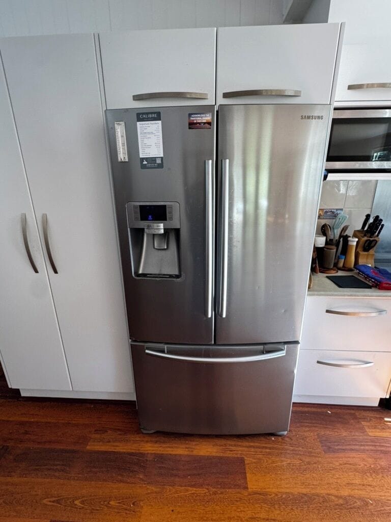 Large fridge/freezer and water filter and pantry