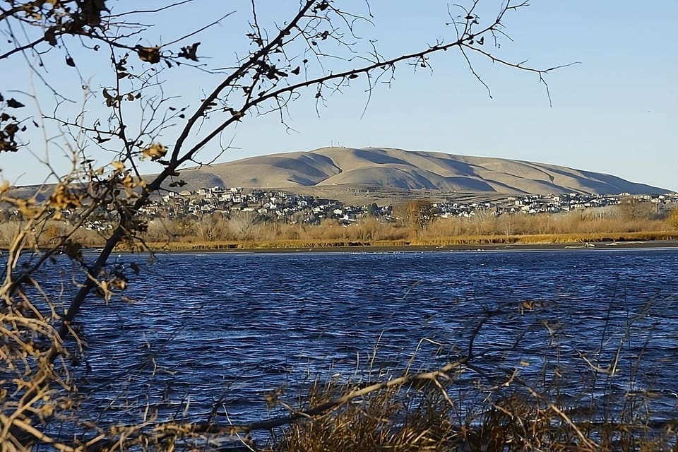 Breathe in riverside calm with sweeping mountain views nearby.