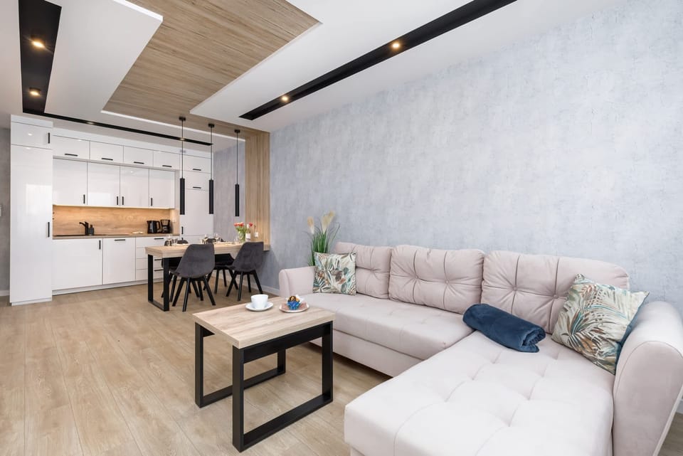 Another angle of the living room, emphasizing the open layout and natural light.
