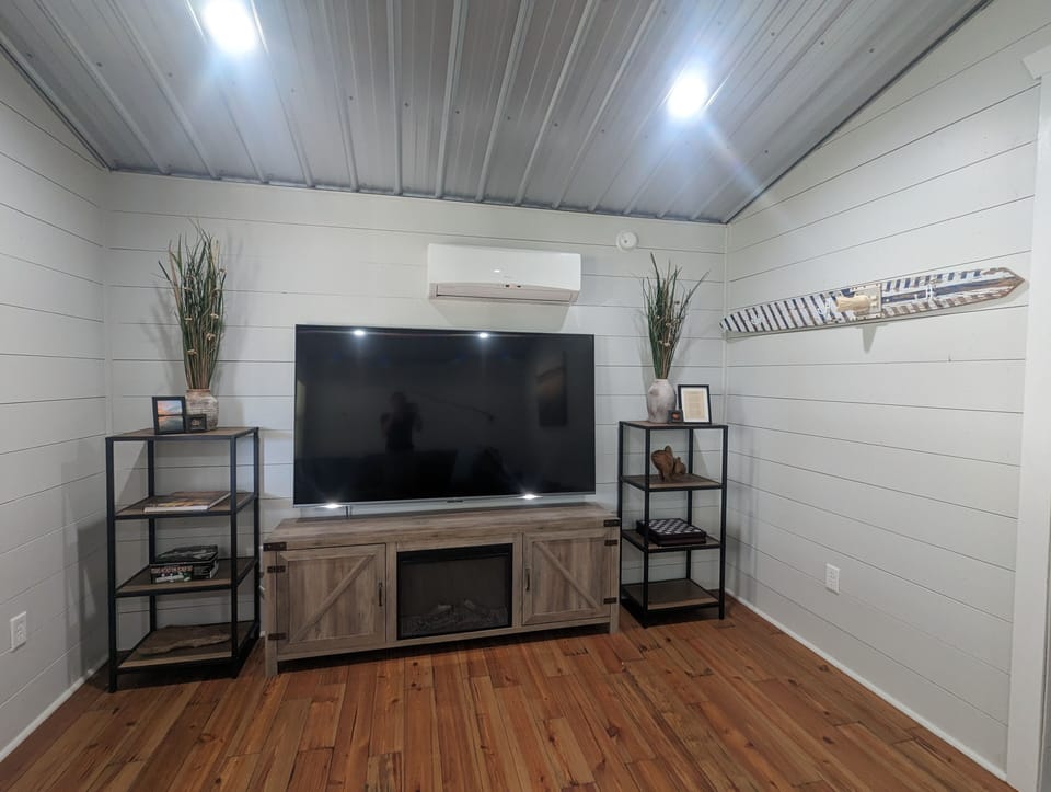 75" flat screen in TV room on main