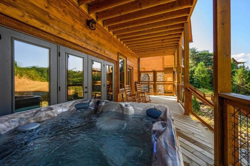 Relax in the hot tub on the lower level deck.