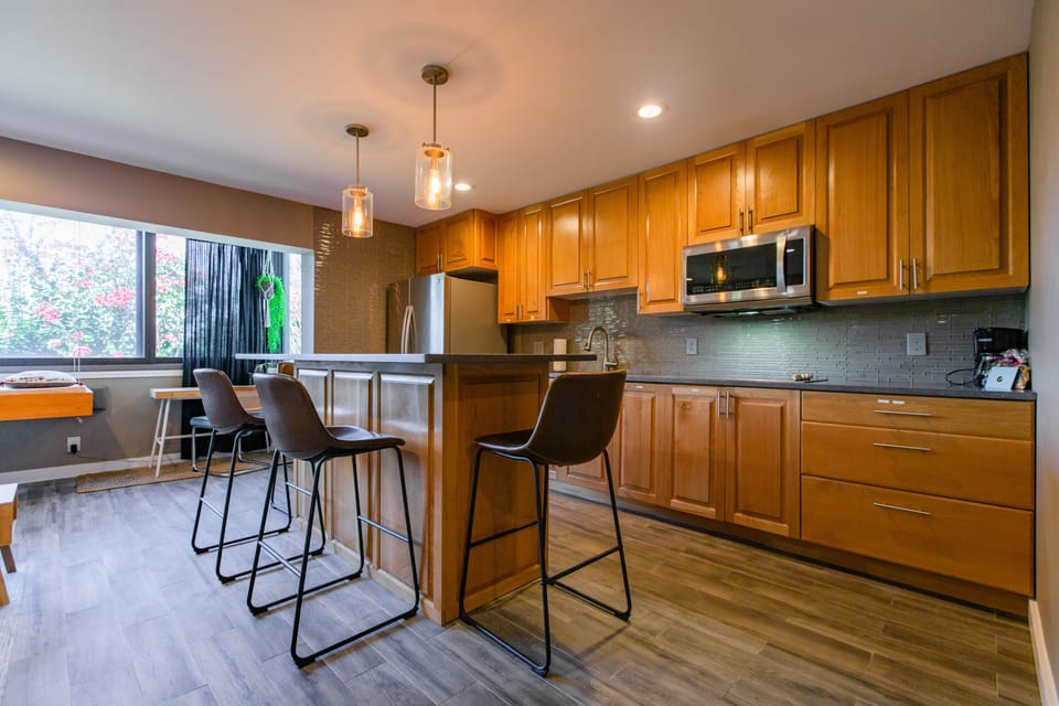 The kitchen boasts a complete design with inviting island seating.