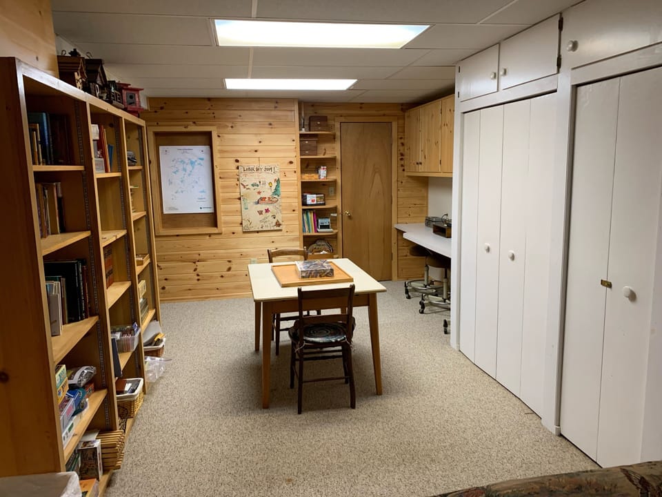 Downstairs office area with large closet for storage.