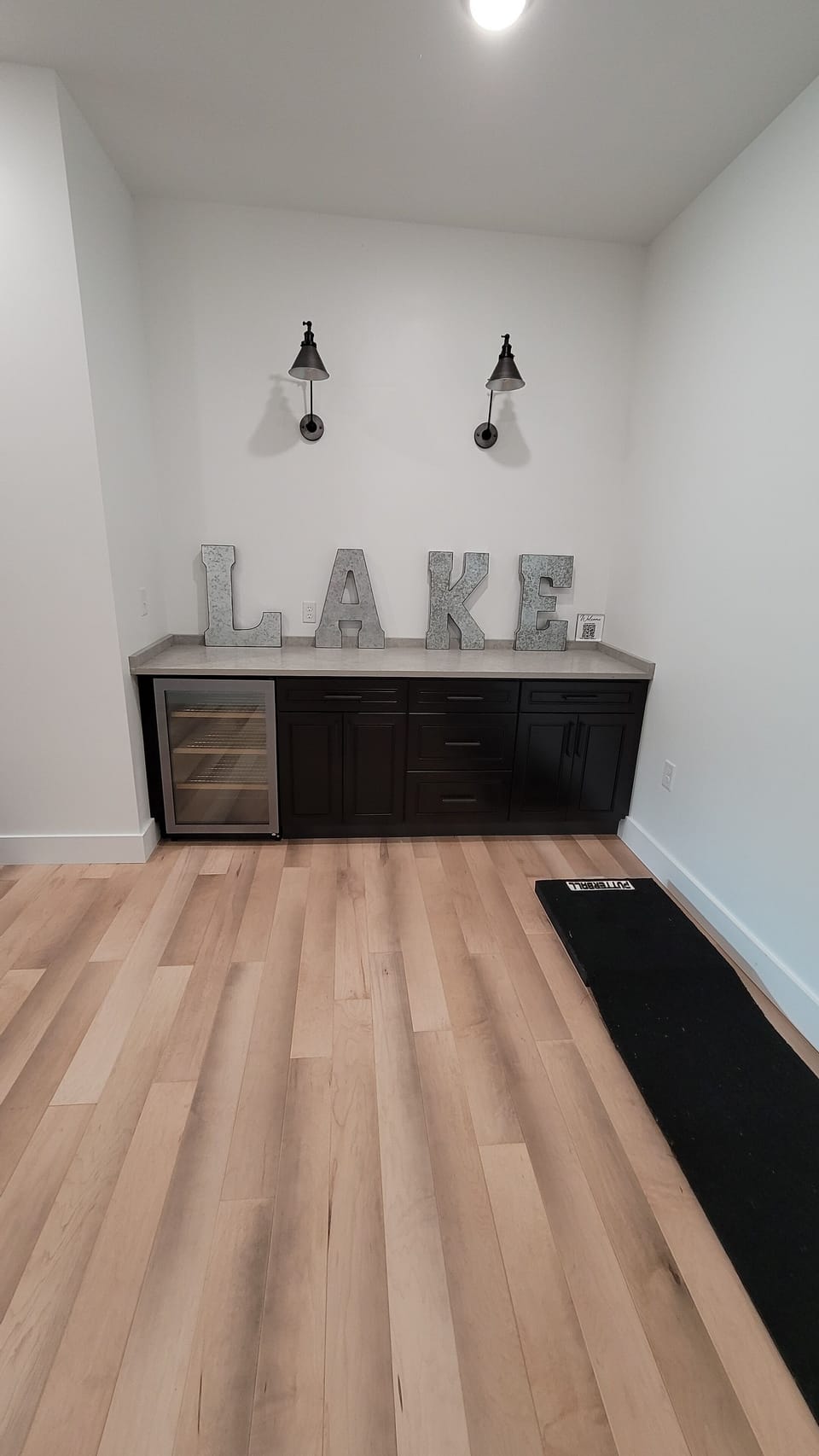 Basement Cabinets w/Undercounter Refrigerator. Perfect place to play Putterball!