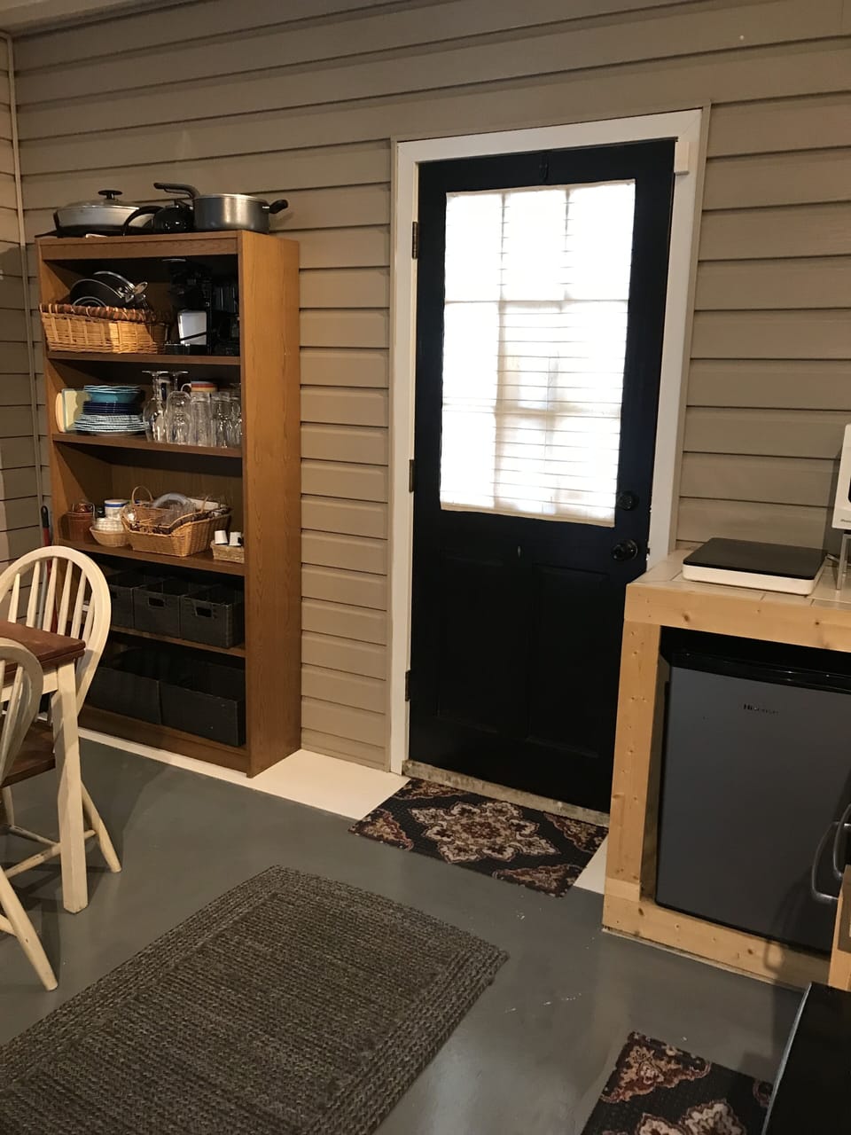 Private entrance with adjustable blinds lets in natural light.