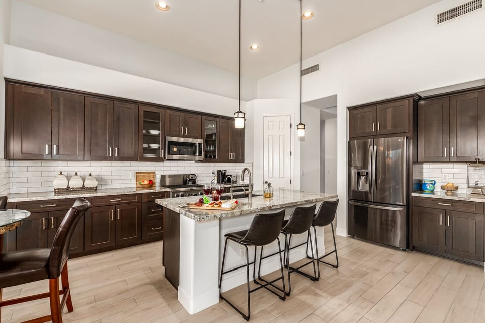 Fully Equipped Kitchen stocked with basic cooking essentials and stainless steel appliances.