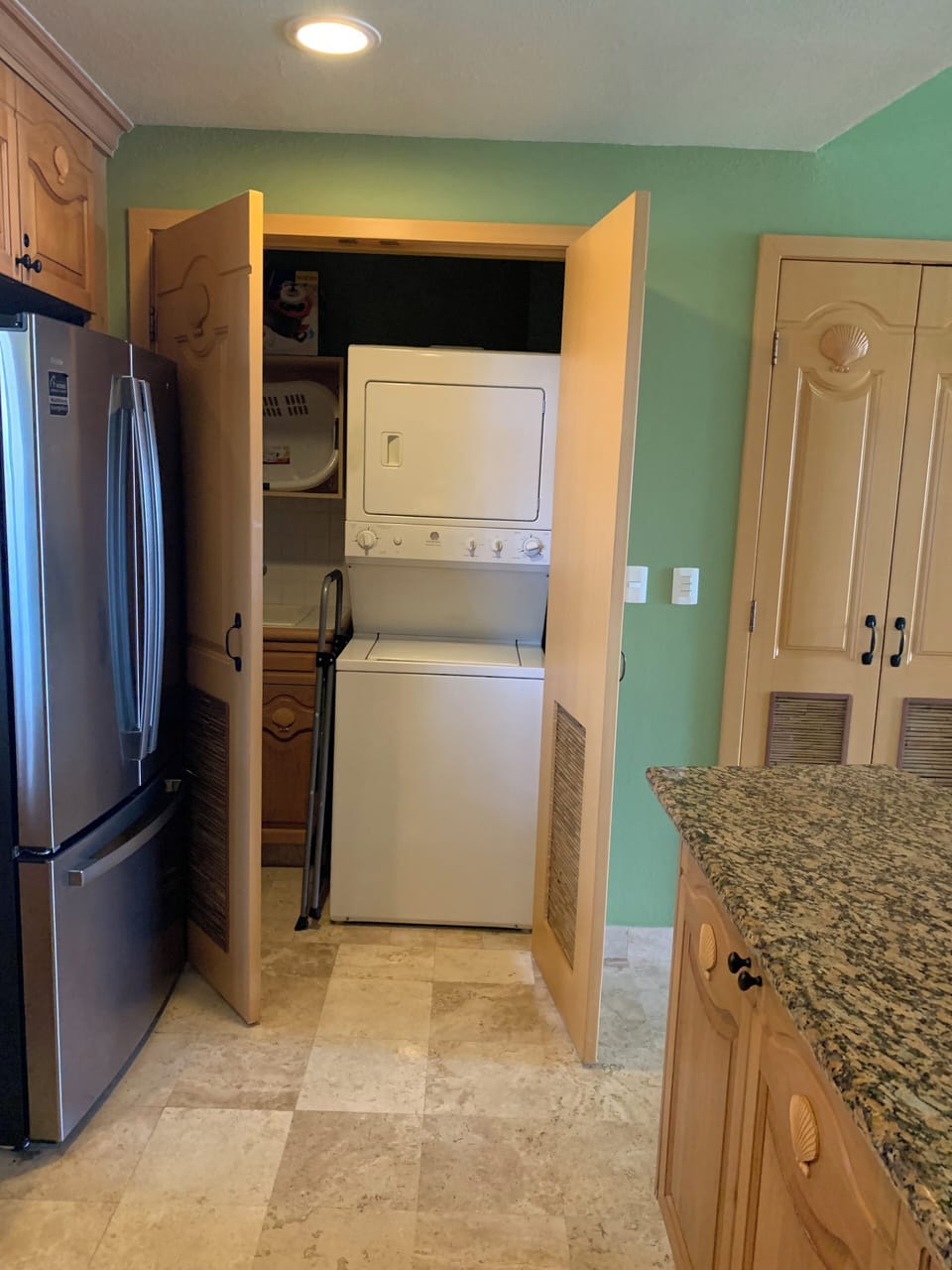 Washer and dryer as well as an ironing board and iron.