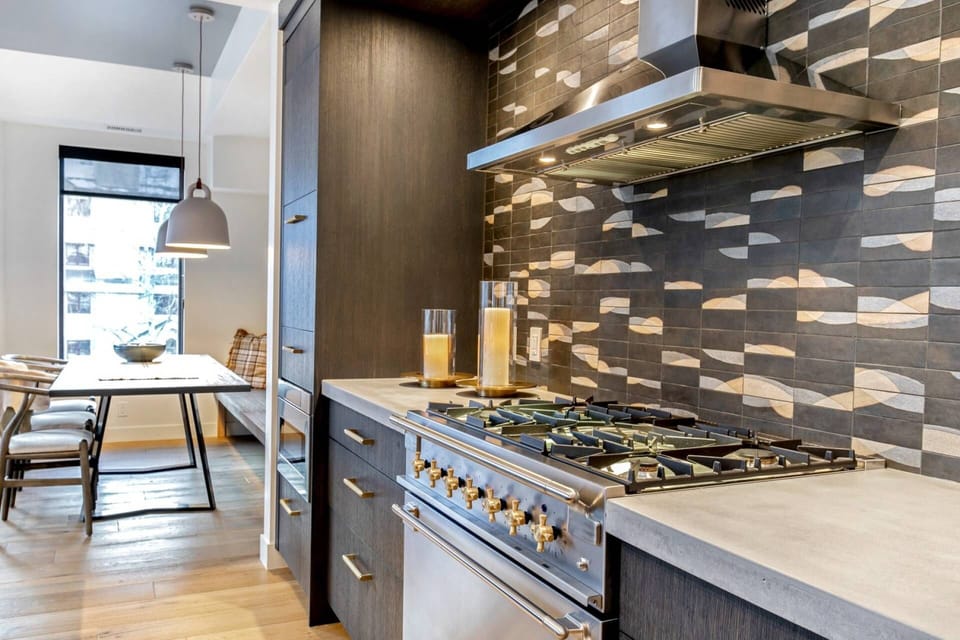 Kitchen features high end appliances, such as a Aga Gas Range