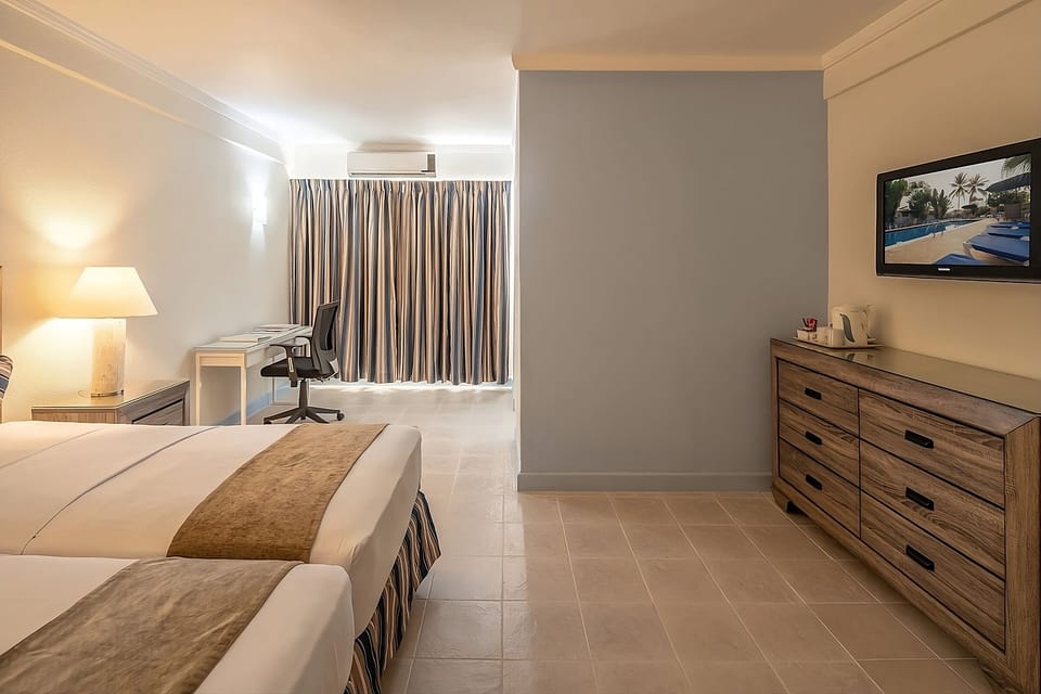 Unit with 2 single beds.  Exact unit will be assigned upon arrival. Views, colors and decor may vary.