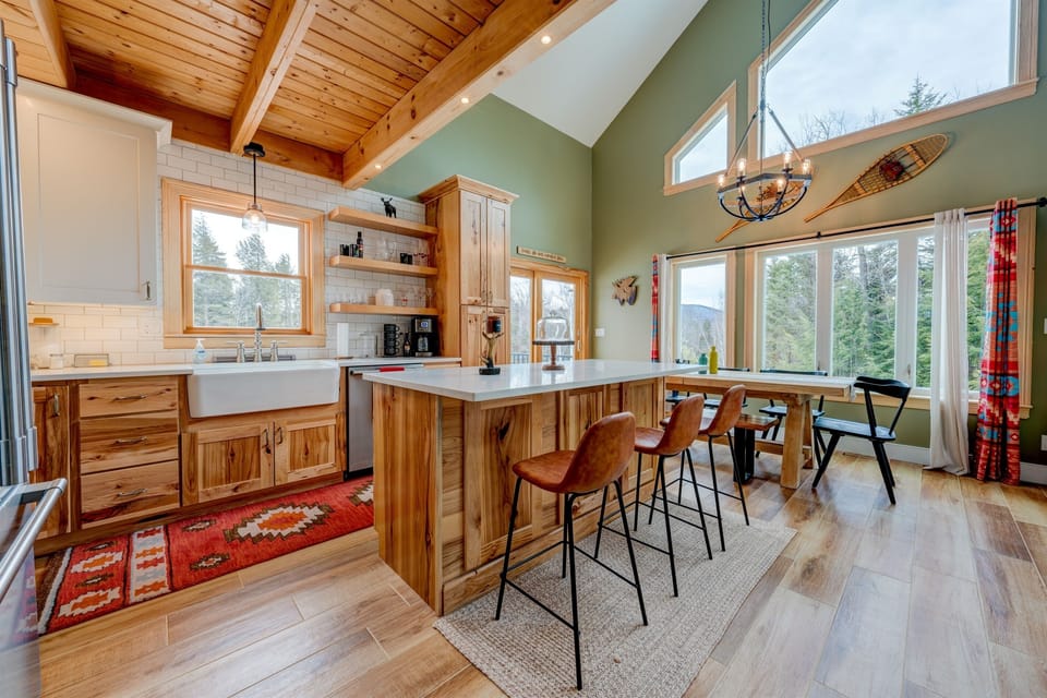 Kitchen Island with seating for 4.  4th chair is in the closet.