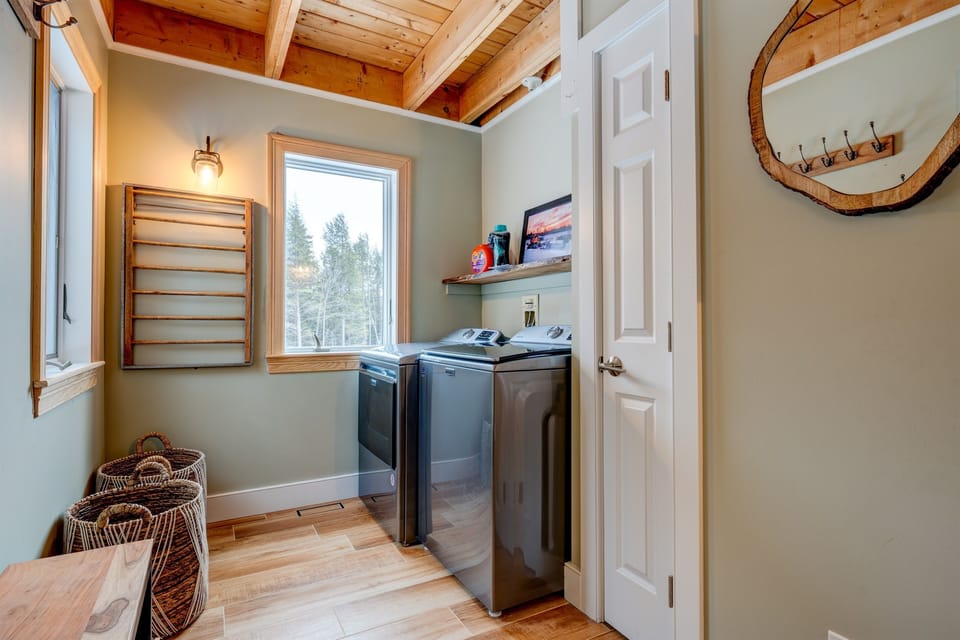 Laundry Room and Mud room with a door that leads to the side where the driveway is.  
