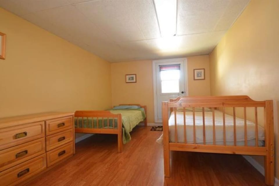 Basement Bedroom (4), 2 Single Size Beds, Linens, Closet & Dresser