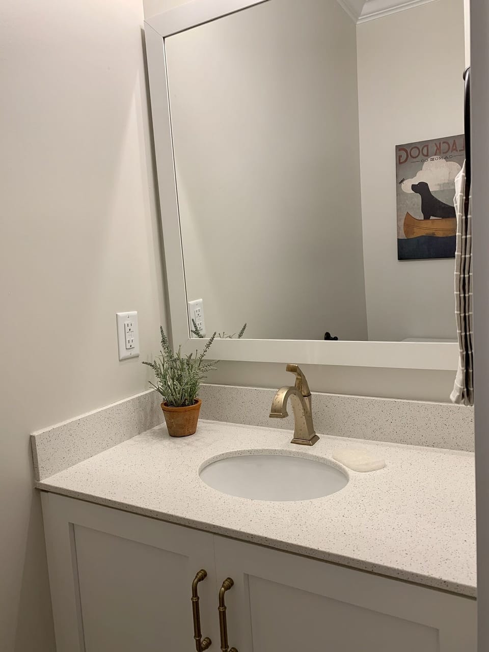 Half bath just off of kitchen in mud room. 