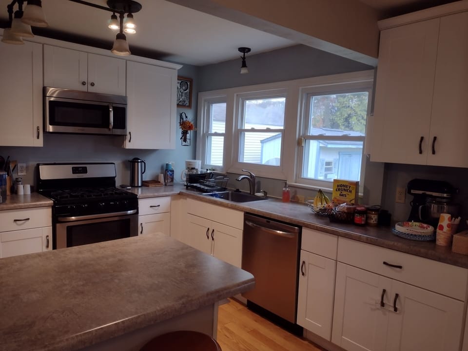 Kitchen (photo 1).  Remodeled.  Fully stocked kitchen, bar stools by the island