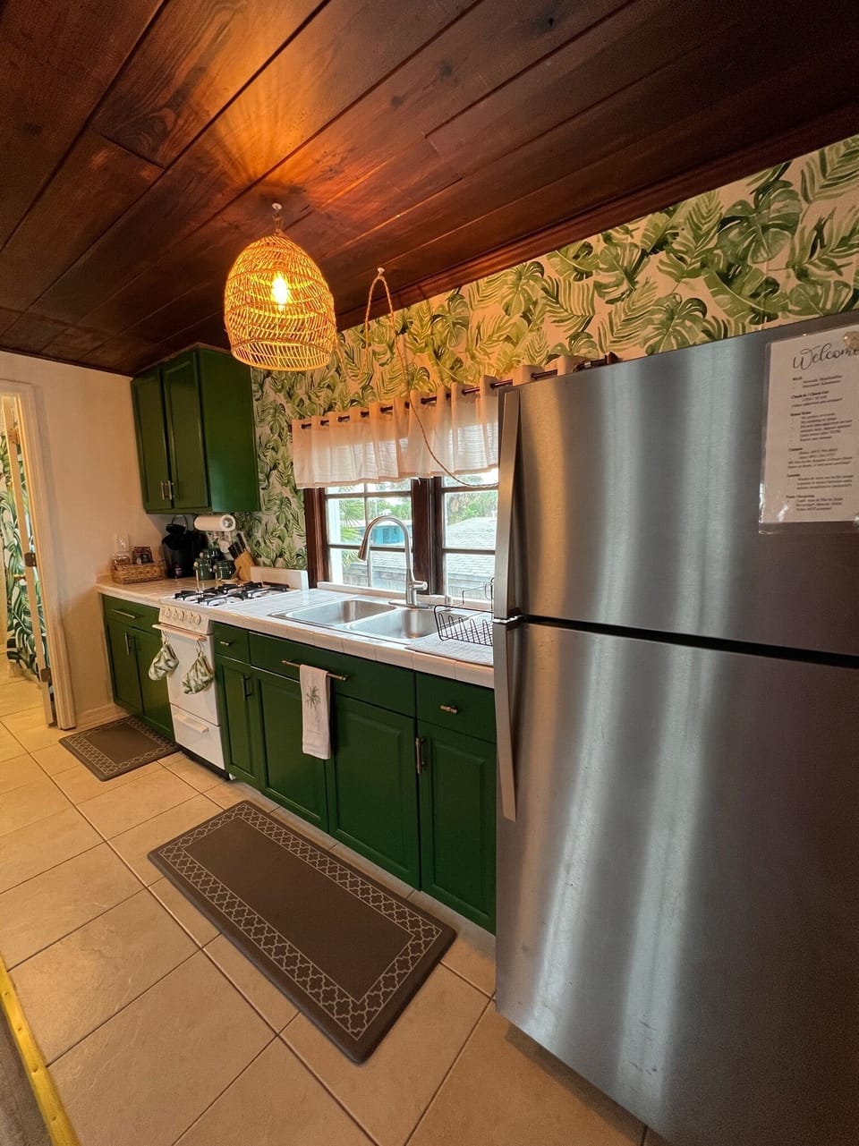 Kitchen has refrigerator, stove/oven, microwave, plenty of cooking supplies