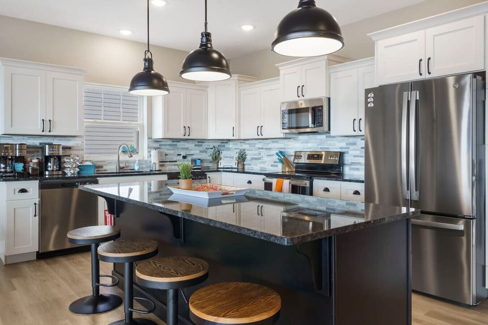 Fully Stocked Kitchen with stainless steel appliances. 2 ovens, 2 refrigerators, 2 dishwashers, microwave, and coffee station (single servings and drip, including cream and sugar).