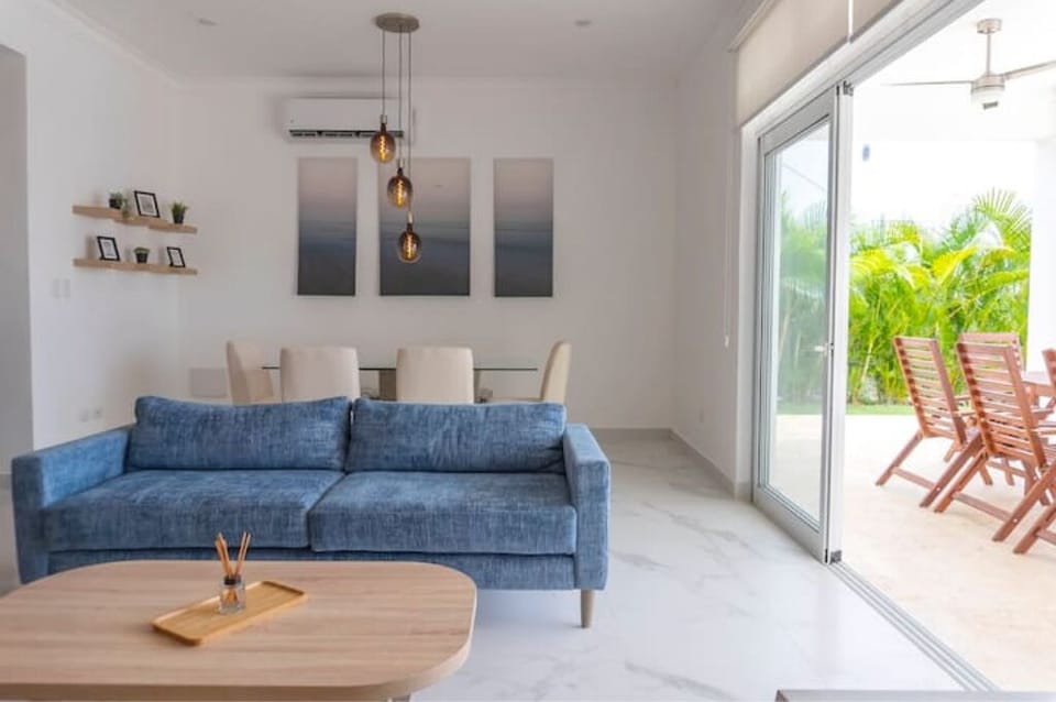 Living/Dining area with air conditioner and walkout.