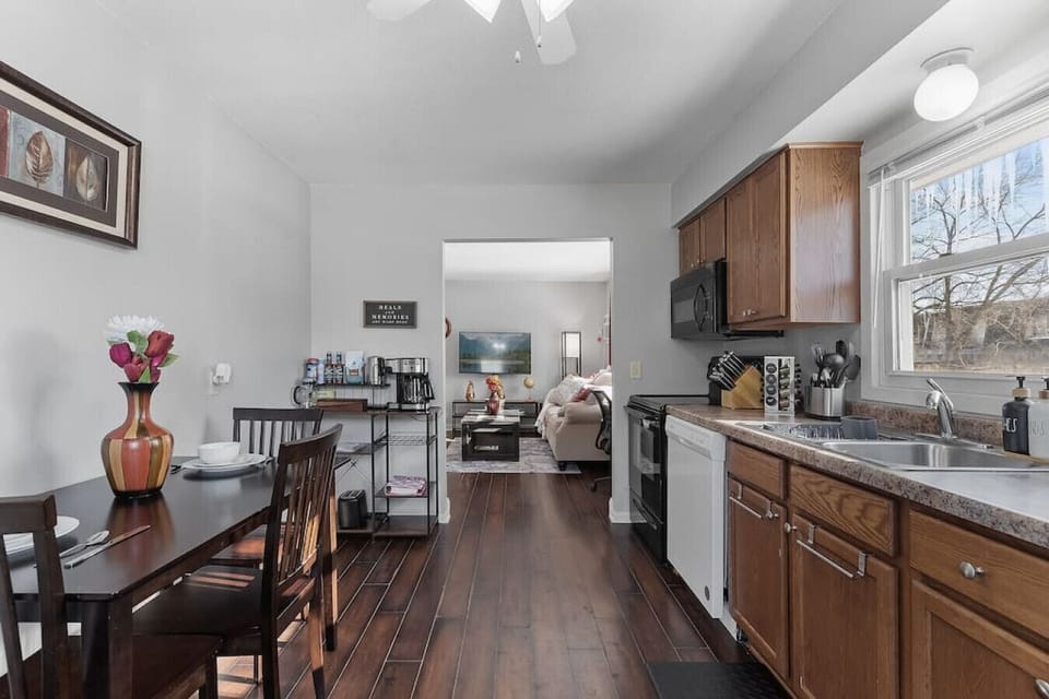 Kitchen View 2 - Everything you need to cook (pots, pans, etc.), dine (plates, cutlery, glasses, etc.) and clean.
