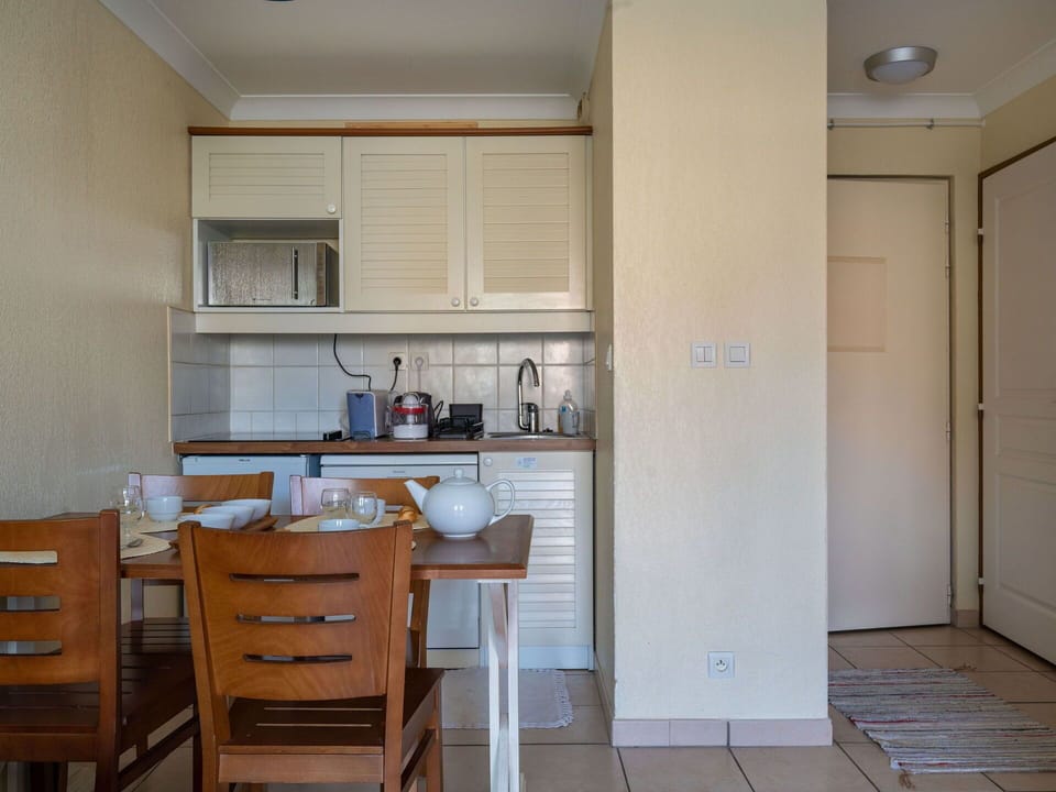 Cabinetry, Furniture, Countertop, Table, Chair, Door, Wood, Interior Design, Kitchen, Flooring