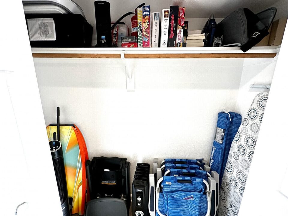 2 Beach umbrella, 4 beach chairs, 2 boogie boards, small ice chest, pack n play, high chair, games, fan, games, puzzles and more.