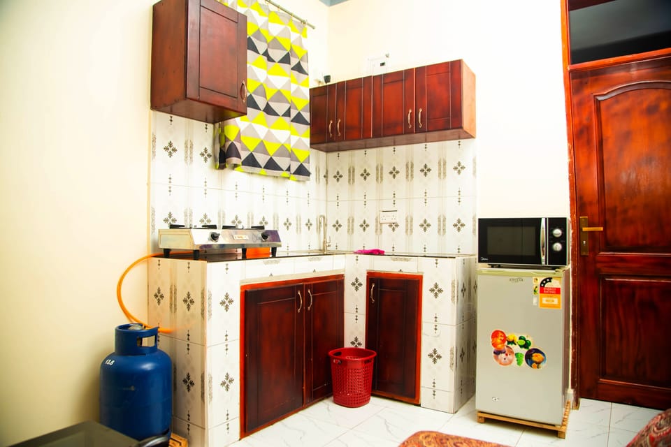 kitchen Area with gas stove 200ltr fridge and micro wave