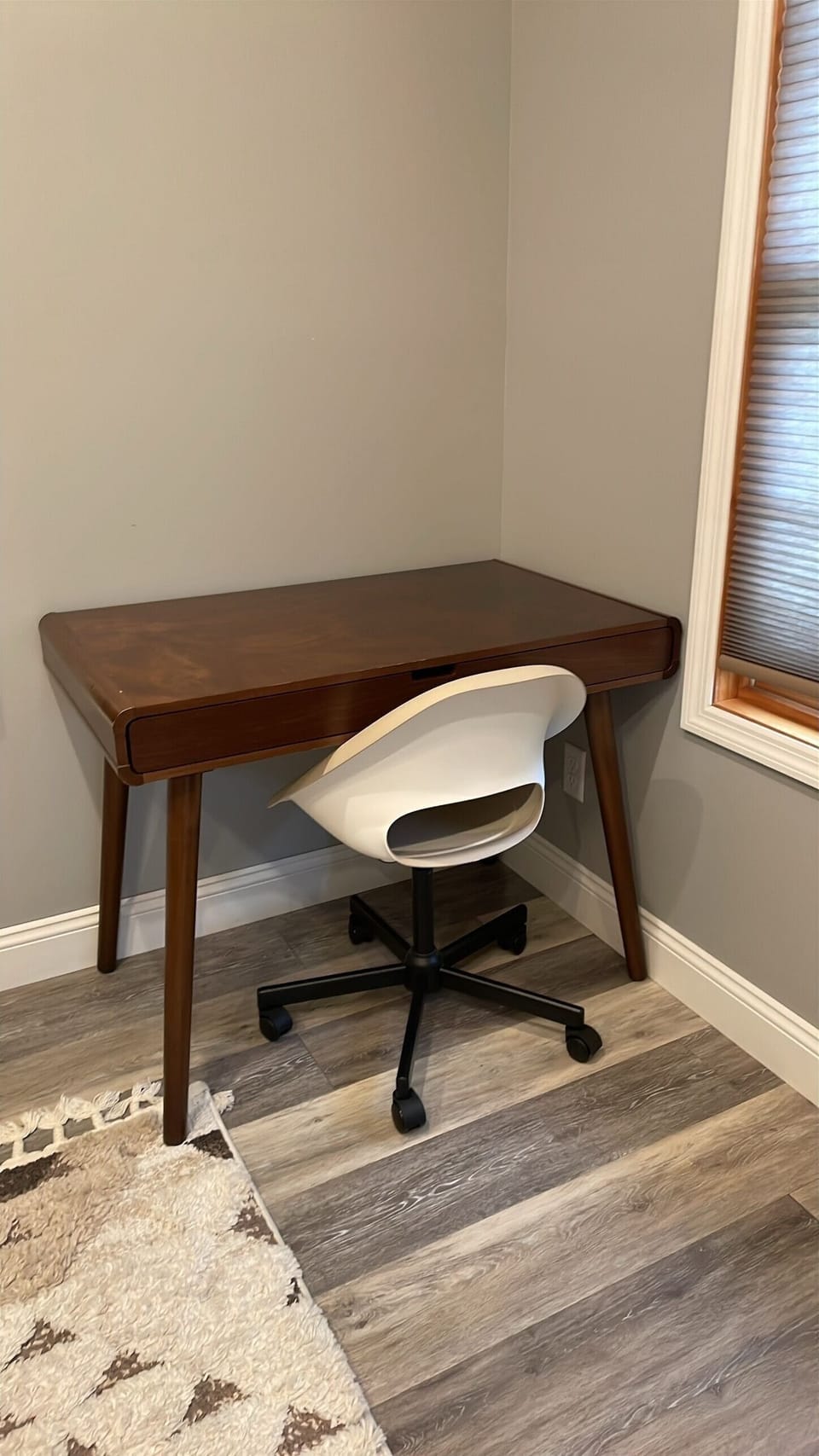 Dedicated workspace with a comfortable desk and chair for remote work.