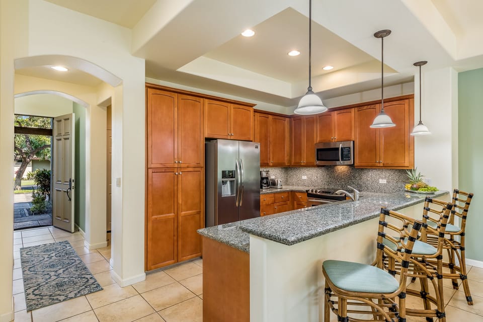 There’s room for everyone in this beautifully designed kitchen—complete with island seating for casual meals or cocktails.