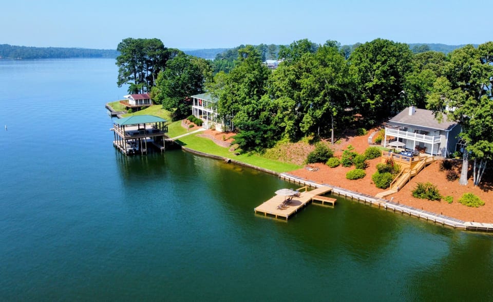 Beautiful deep water cove home is behind no wake zone with big water nearby. 
