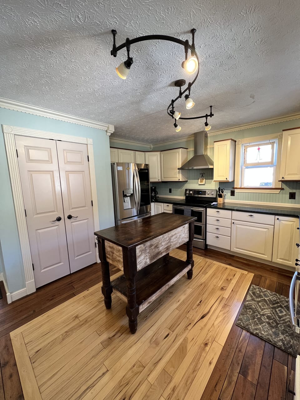 Fully stocked kitchen with electric stove/oven, dishwasher, pantry, fridge