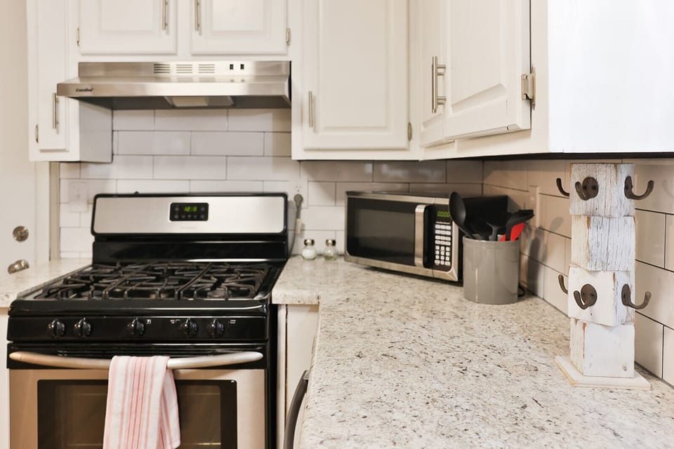 Updated countertops and a stylish subway tiled backsplash