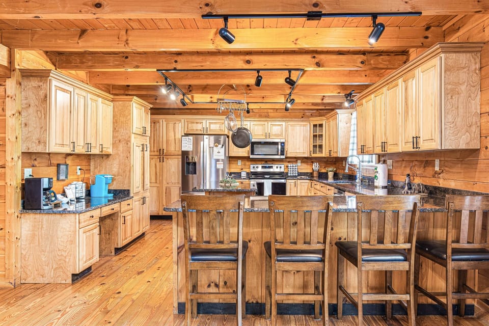 Fully equipped kitchen with modern amenities, ready for home-cooked meals and unforgettable feast.