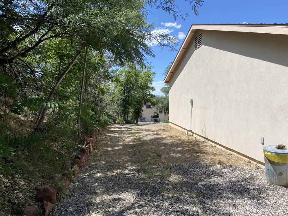 Private driveway just for you and parking space - small flower garden at end