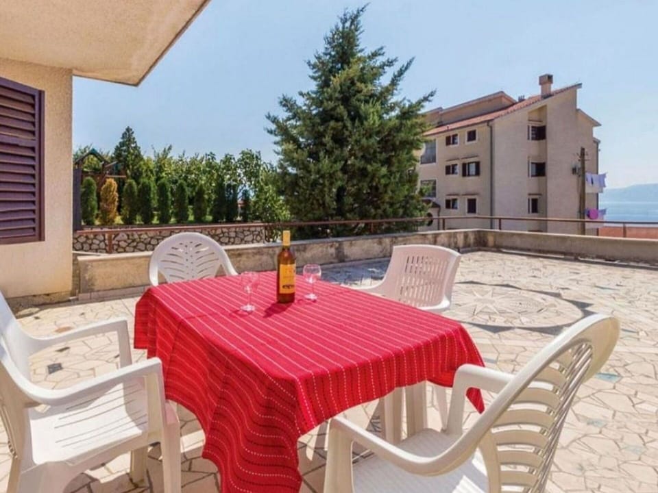 Sky, Table, Furniture, Building, Property, Chair, Window, Wood, Outdoor Table, Outdoor Furniture