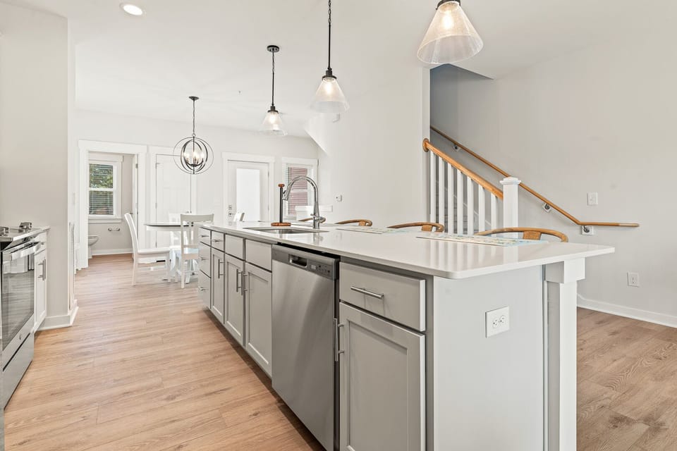 Kitchen with Bar Seating and Deck Access on Second Level