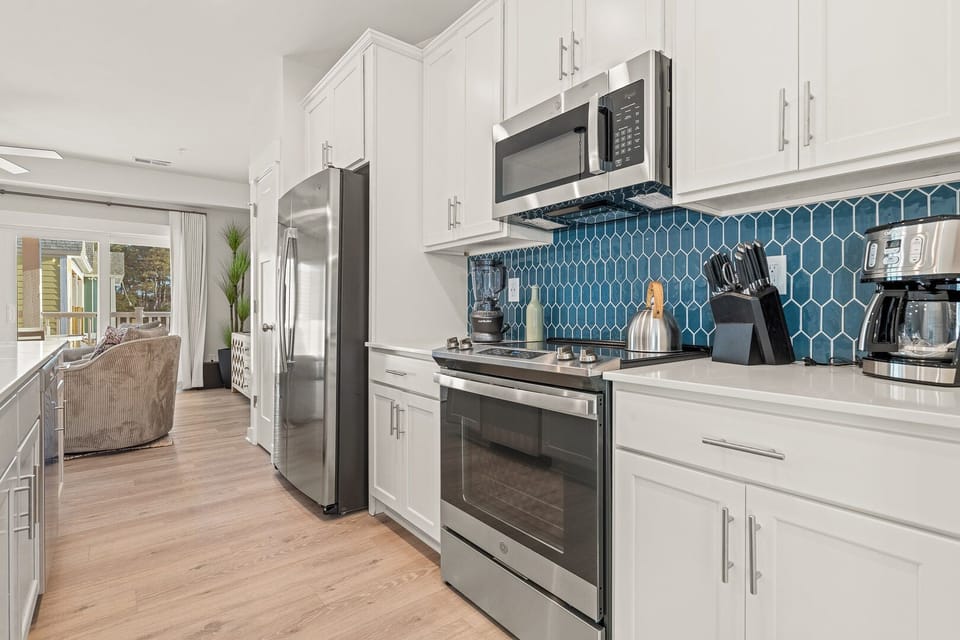 Kitchen with Bar Seating and Deck Access on Second Level