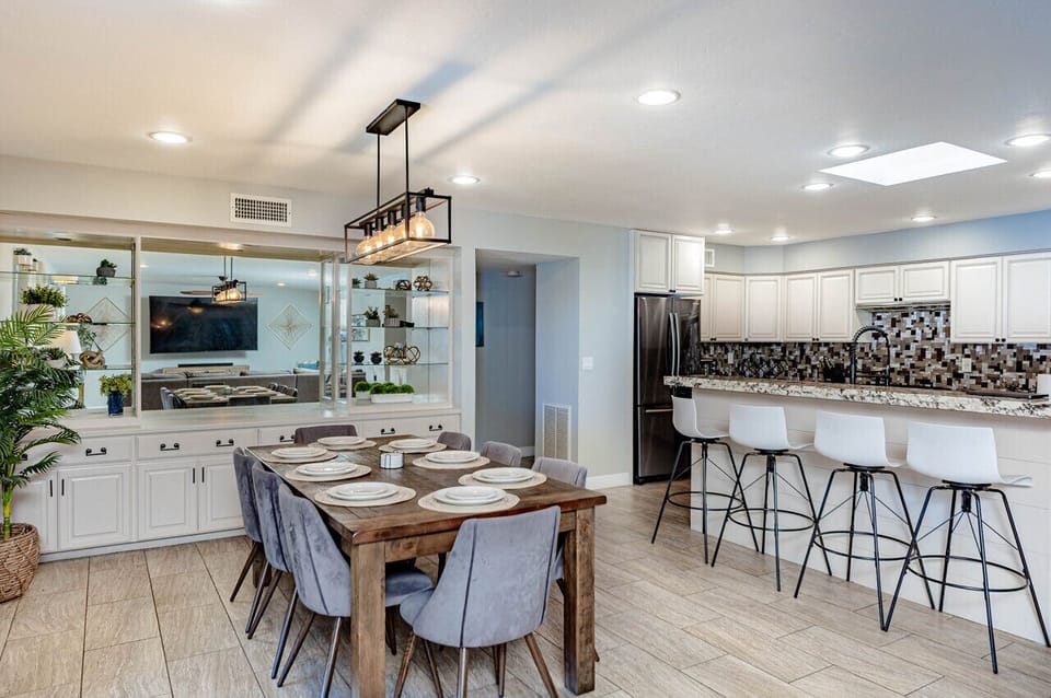Eight (8) seater dining table with Four (4) barstools at the kitchen counter