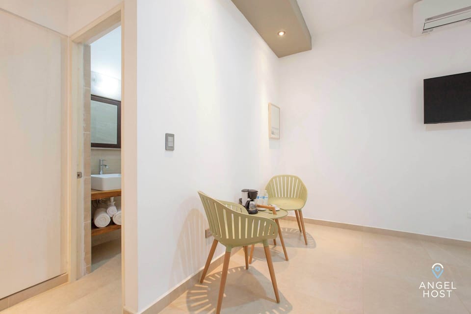 Compact table and chairs suitable for dining or work.
