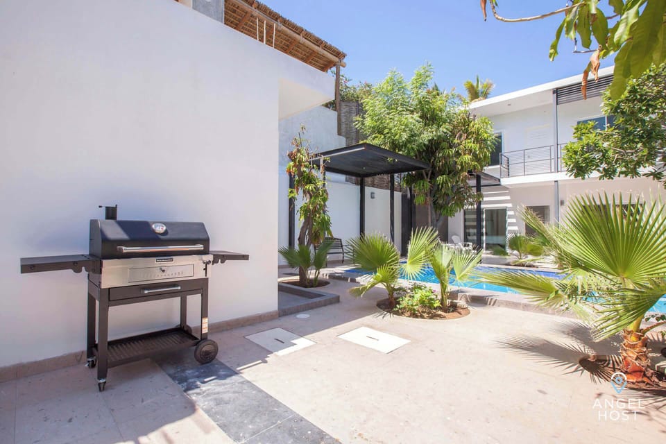 Communal BBQ area for outdoor cooking.