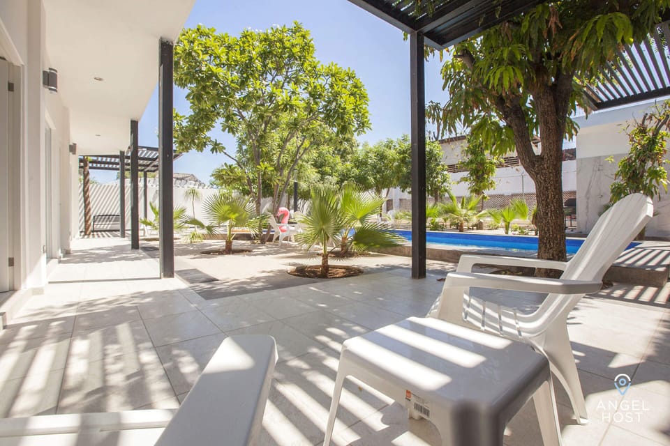 Lots of greenery surrounding the pool