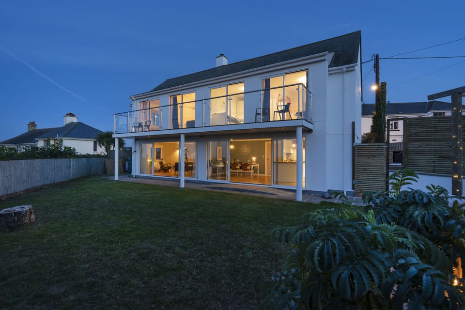 Night time shot of property with secure gated garden.