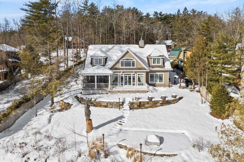 Snowy winter view of the home from Lakeside. 