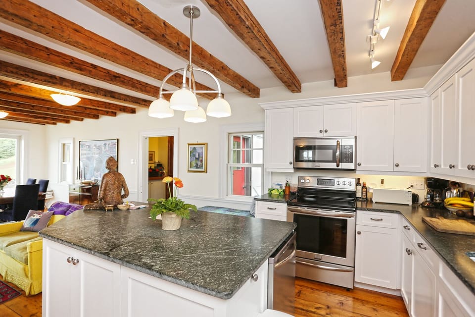 Kitchen is well equipped with cookware and dishes