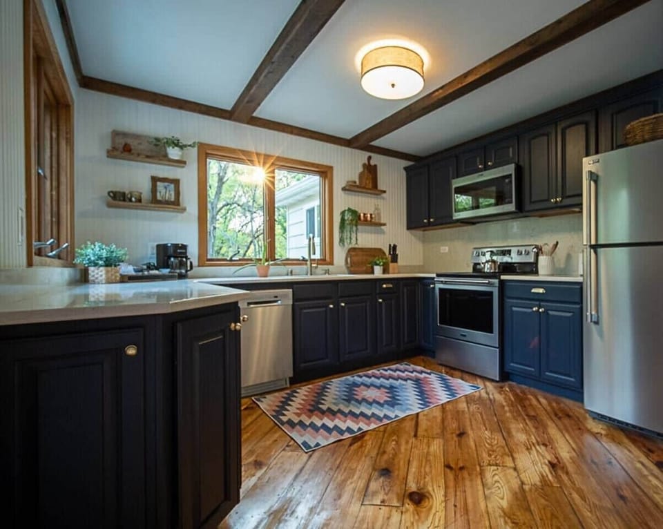 Prepare your favorite meals in this redesigned kitchen, with quartz counter tops and all new appliances.